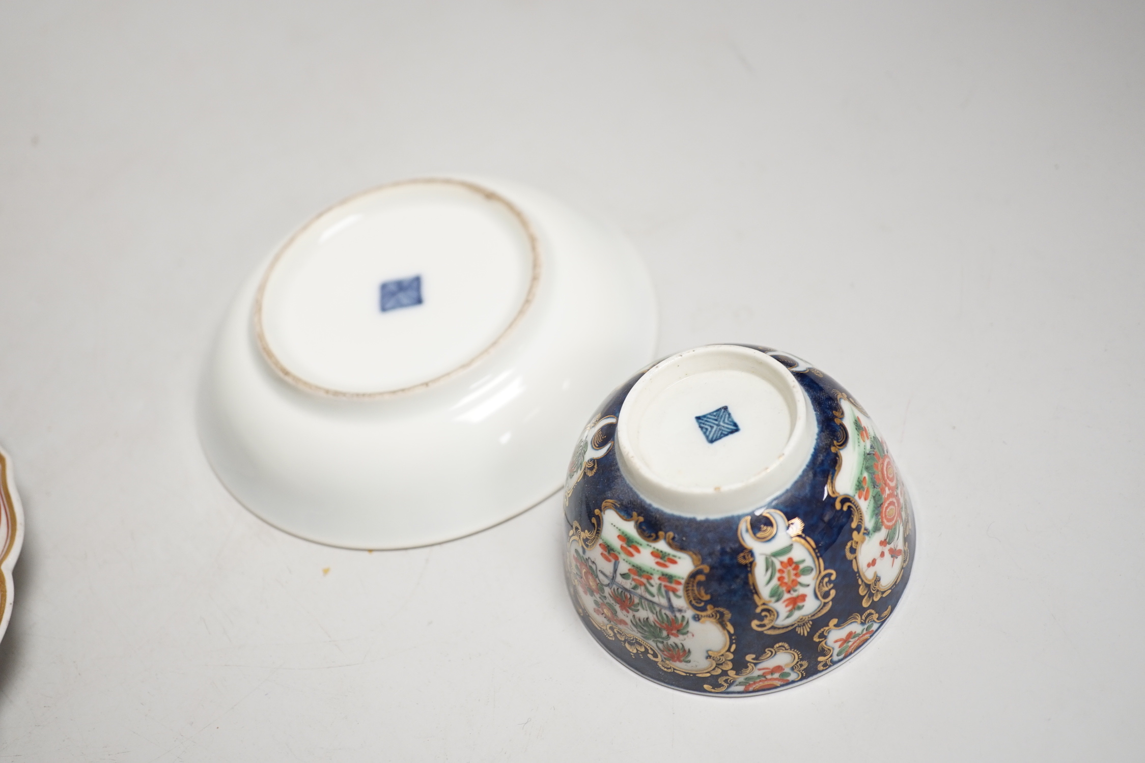 A Worcester kakiemon style scale blue trio, c.1770, a Worcester Queen Charlotte’s pattern plate, 19.5 cm and a Samson saucer in Worcester style
